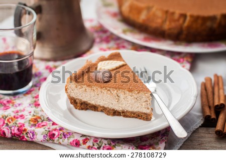 A Slice of Spiced Coffee Cheesecake Dusted with Cocoa Powder