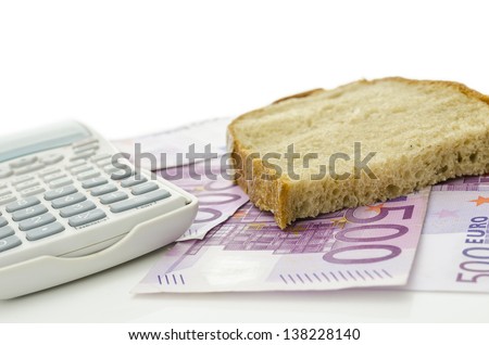 Piece of bread on Euro banknotes. Representing how more and more expensive food is these days.