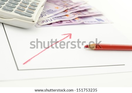 Growing business graph with red arrow with Euro banknotes and calculator in background.