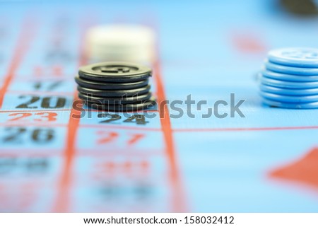 Gaming chips on blue casino cloth. Gambling concept.