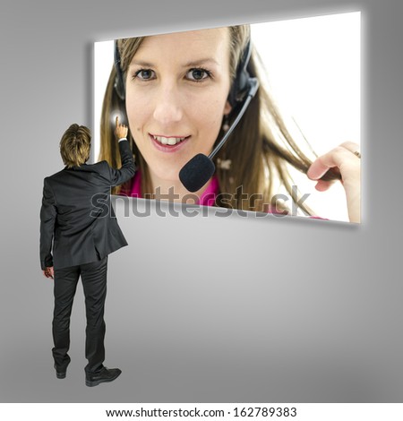 Businessman choosing online customer support on a virtual screen.
