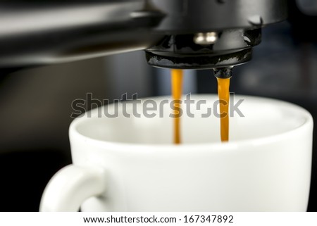 Closeup of coffee machine making espresso.