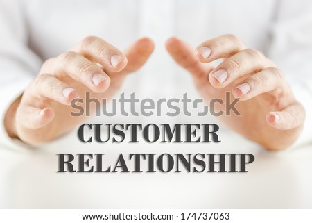Man protecting the words - Customer Relationship - with his hands conceptual of quality service, guaranteed support and client services