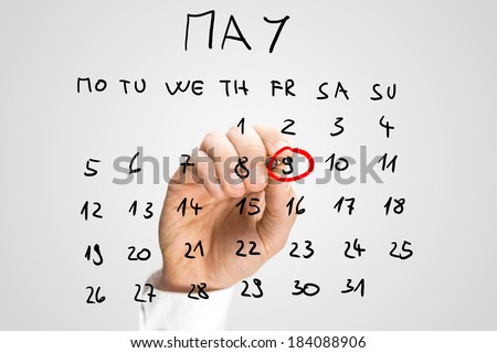 Man marking Victory Day, 9th May, commemorating the capitulation of Nazi Germany to the Soviet Union in the Second World War, on a handwritten calendar on a virtual interface.