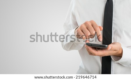 Close Up of Businessman Using Touch Screen Smartphone with Copyspace.