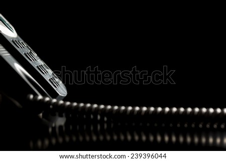 Dial-up buttons on the keypad of a landline telephone instrument over black background. Conceptual of customer service or customer support.
