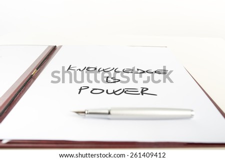 Conceptual Handwritten Knowledge is Power Message on a White Paper on White Background.