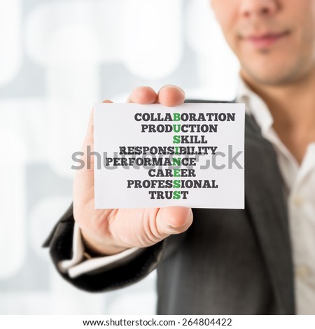 Businessman Holding a Conceptual Small White Card with Business Text and Other Related Words, Emphasizing Collaboration, Production, Skill, Responsibility, Performance, Career, Professional and Trust.