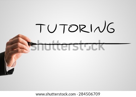 Close up Businessman Hand with Marker Pen Writing a Conceptual Underlined Tutoring Text Against Abstract Gray Background.