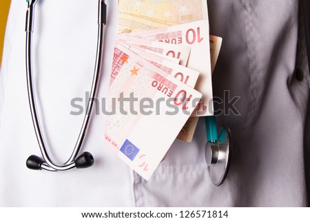 doctor with money in her pocket white coat