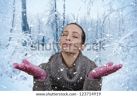 Young beautiful woman in nature when it snows
