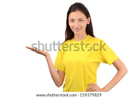 Beautiful girl presenting. Attractive girl with yellow t-shirt. Isolated on white.