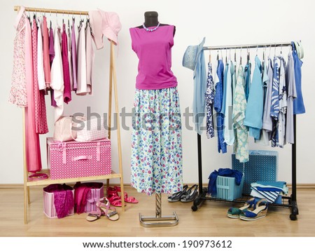 Dressing closet with pink and blue clothes arranged on hangers. Cute summer outfit on a mannequin. Wardrobe full of all shades of blue and pink clothes, shoes and accessories.