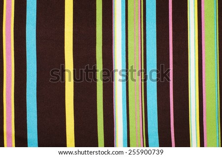 Green, blue, brown striped background. Colorful vertical stripes fabric pattern.