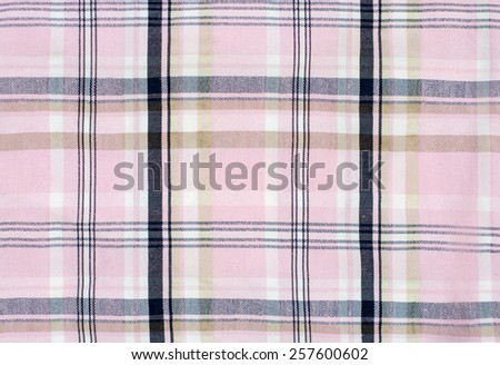 Pink tartan pattern. Pink and blue plaid print as background. Symmetric square pattern.