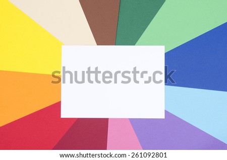 White sheet paper. Blank white paper on rainbow color paper background.