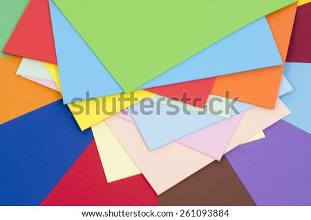 Color paper piled. Stack of paper on multicolor background.