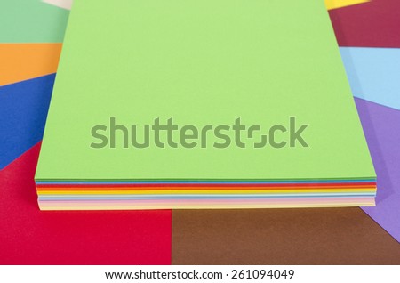 Color paper piled.  Stack of paper on multicolor background.