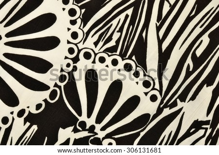Abstract circles and stripes monochrome design pattern on fabric. Graphic black and white design print as background.