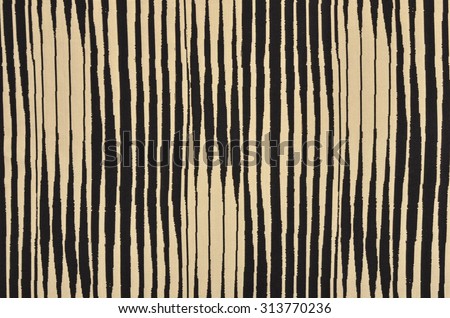 Black and brown with white striped background. Asymmetric vertical stripes pattern on fabric.