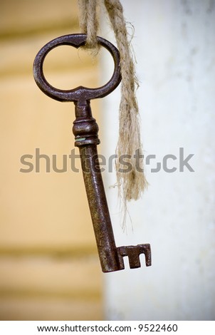 antique key hanging in a string