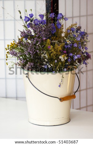 summer flowers in a bucket