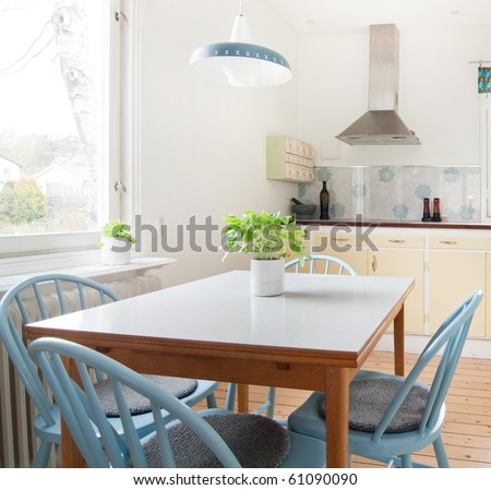 interior of kitchen with a table and basil