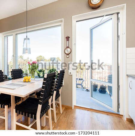 kitchen table by the open balcony door