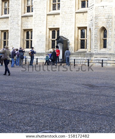 LONDON - OCTOBER 7 :Queen\'s Guard - Tower of London on October 7-10-2013. The Queen\'s Guard is the contingents of infantry and cavalry soldiers charged with guarding the official royal residences.