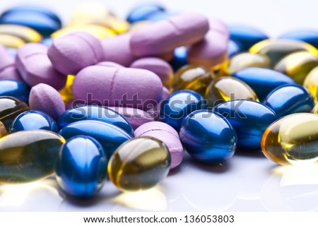 colorful vitamin gel capsules isolated on whiteback ground