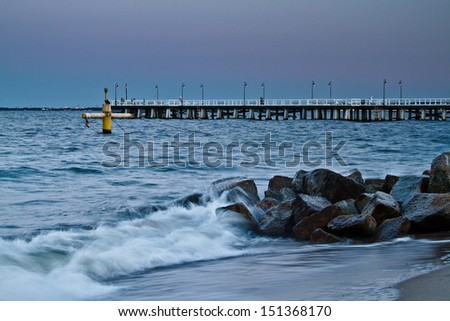 Baltic pier in Gdynia Orlowo at night, Poland. Sunset ot the sea. Long exposure photography