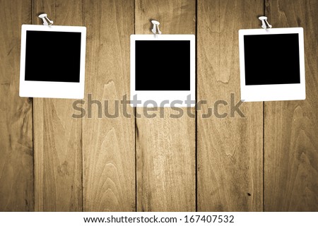 blank photo frames for your photos on wooden background. polaroid frame
