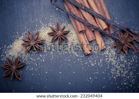 Close up of winter spices , cinnamon, anise, vanilla and brown sugar for christmas cake
