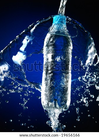 Bottle with pure water and splash around it.