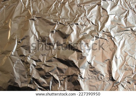Crumpled foil food. The metal foil with a dent.