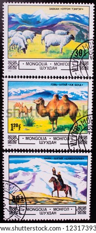 MONGOLIA - CIRCA 1982: A stamp printed in Mongolia shows home animals in the mountain fields , circa 1982.