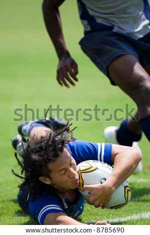 Man in Blue jersey saving a try at Rugby 7s 20007 event