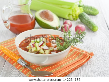 Soup with shrimp, avocado, cucumber and tomato juice in a bowl