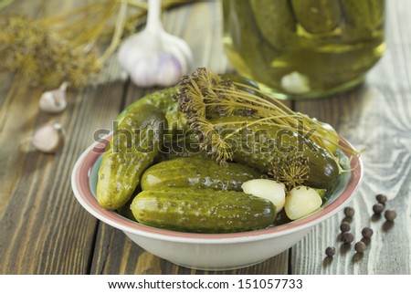 Pickles in a bowl on a wooden table
