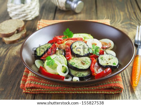 Baked vegetables,  vegetarian food in a bowl on the table