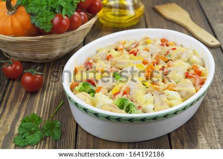 Casserole with chicken fillet and vegetables on the table