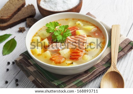 Fish soup in a bowl on the table