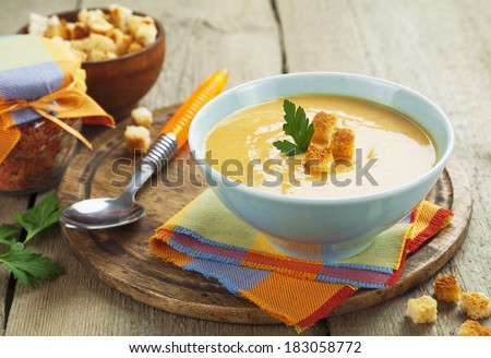 Red lentil soup with croutons in the bowl