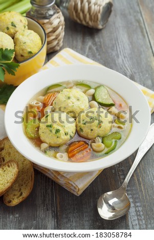 Soup with turkey meatballs in the plate on the table