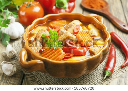 Meat stewed with vegetables in the saucepan
