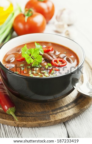 Chili soup with red beans and greens. Mexican cuisine