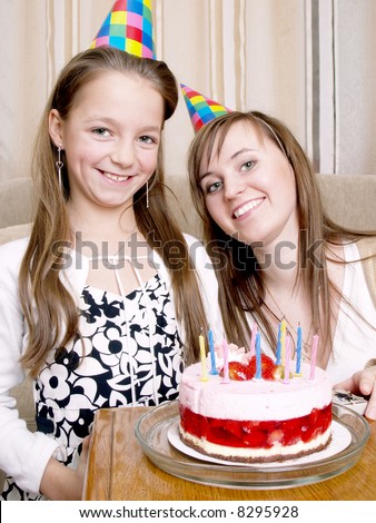mother with daughter and birthday cake