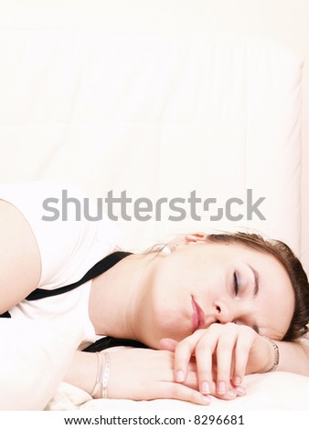 Young woman takes a break and sleeps on the couch