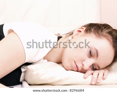 Young woman takes a break and sleeps on the couch