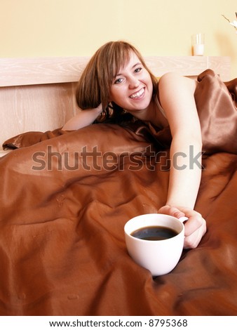 Young woman relaxing in the bedroom